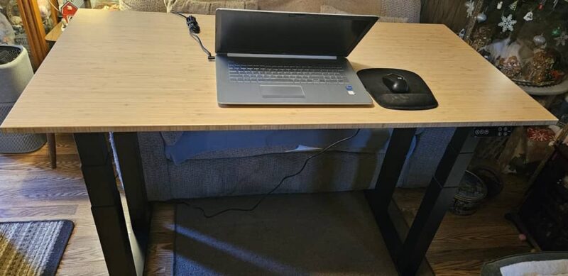 Desk with laptop on it.