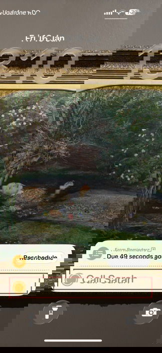 Reminder marked as "Done" via Live Activity on iPhone lock screen. 